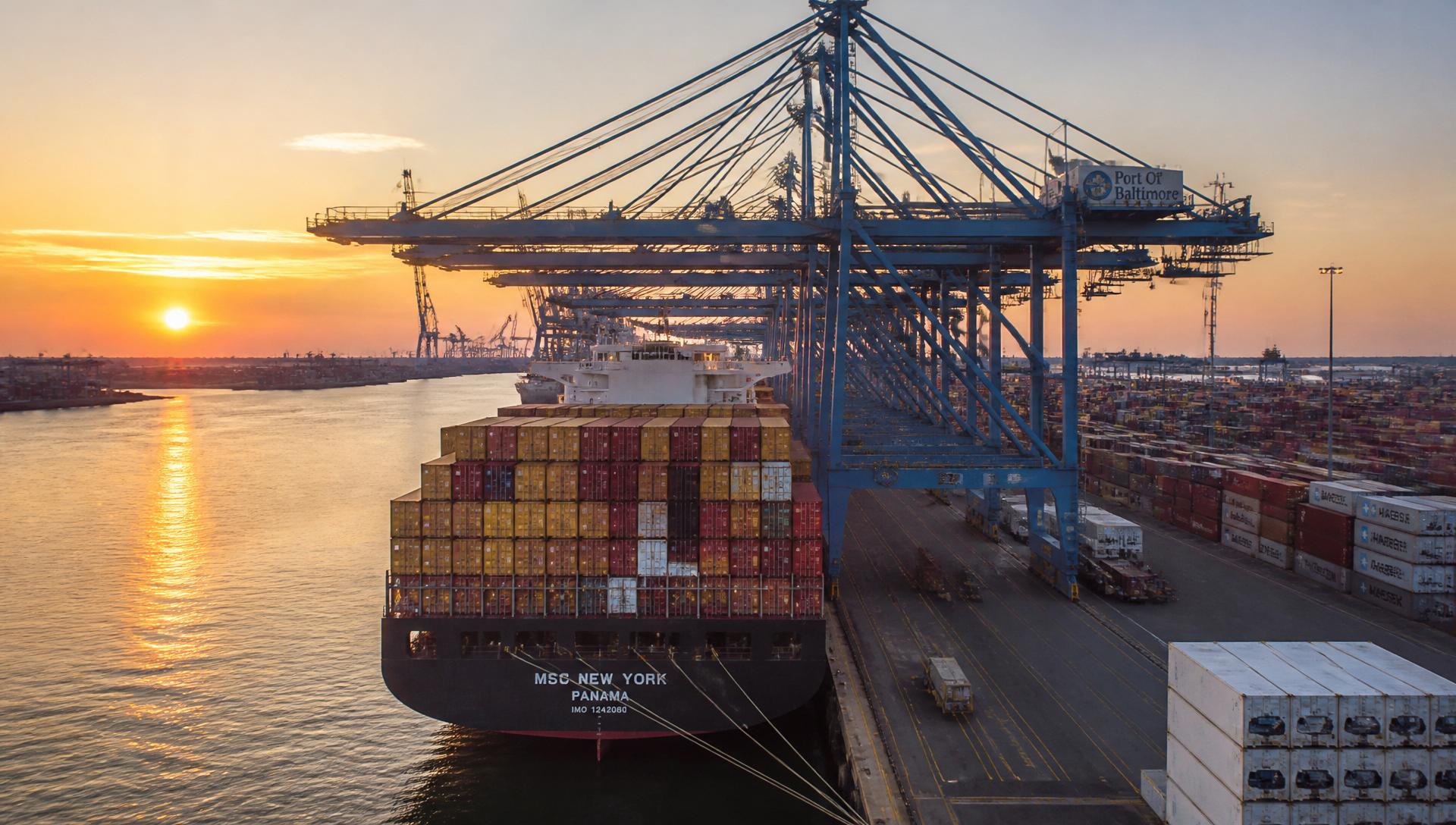 Cargo ship being loaded with containers at an international port